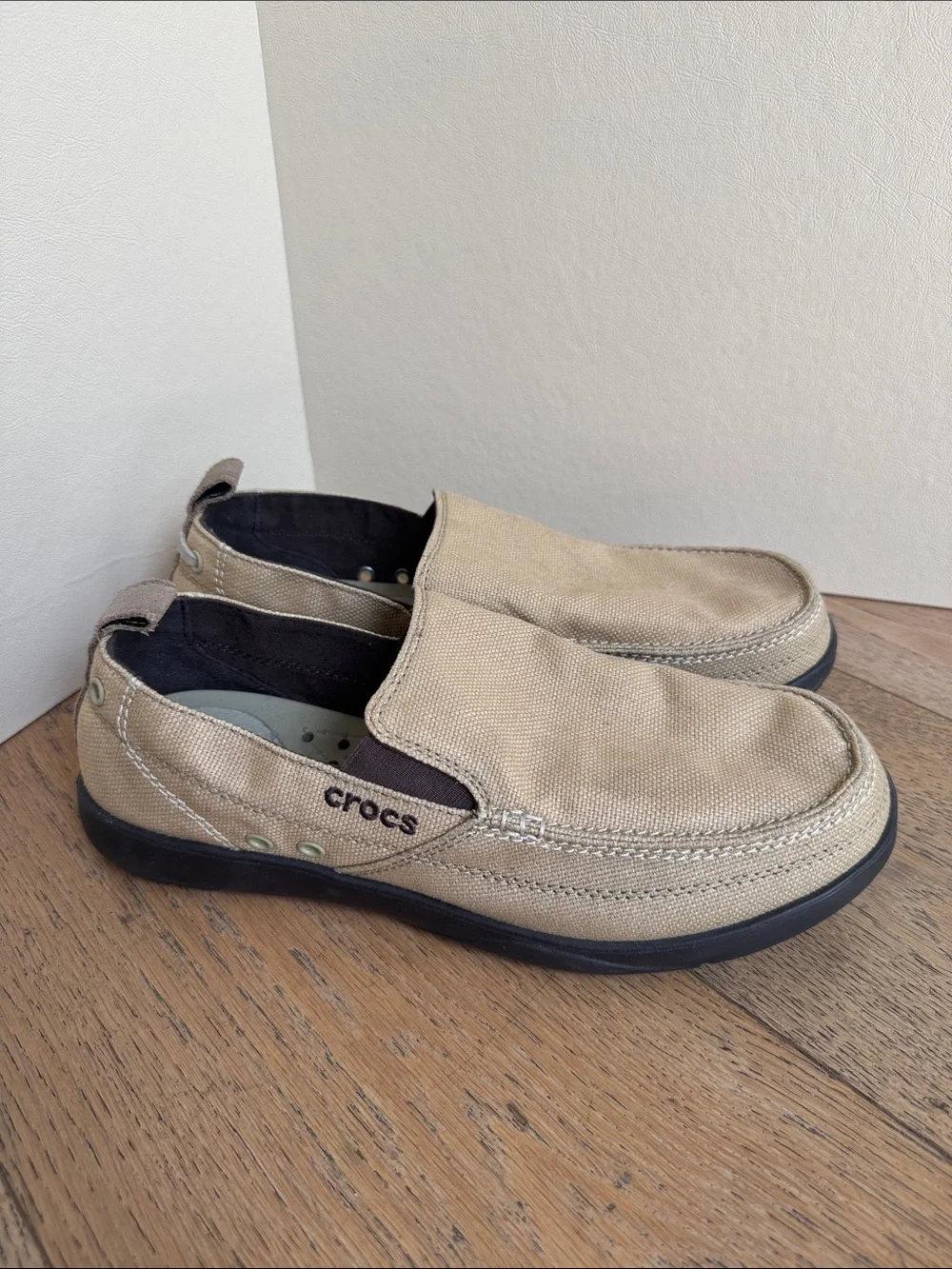pair of khaki canvas Crocs Men's Walu Slip-On Loafers